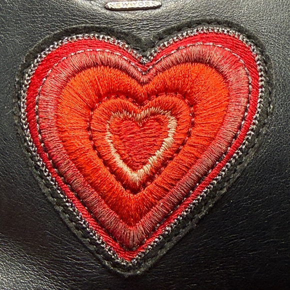 Coach Nolita 19 wristlet/pouch with a red heart appliqué. - Picture 9 of 16
